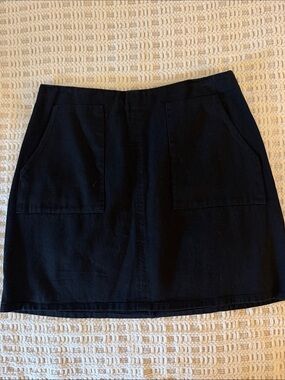 Francesca’s Mi Ami Black Mini Skirt Size L Patch Pockets NWT